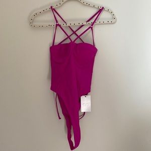 EGO SWIM hot pink one piece with cut out strappy back & bare cheeks details.